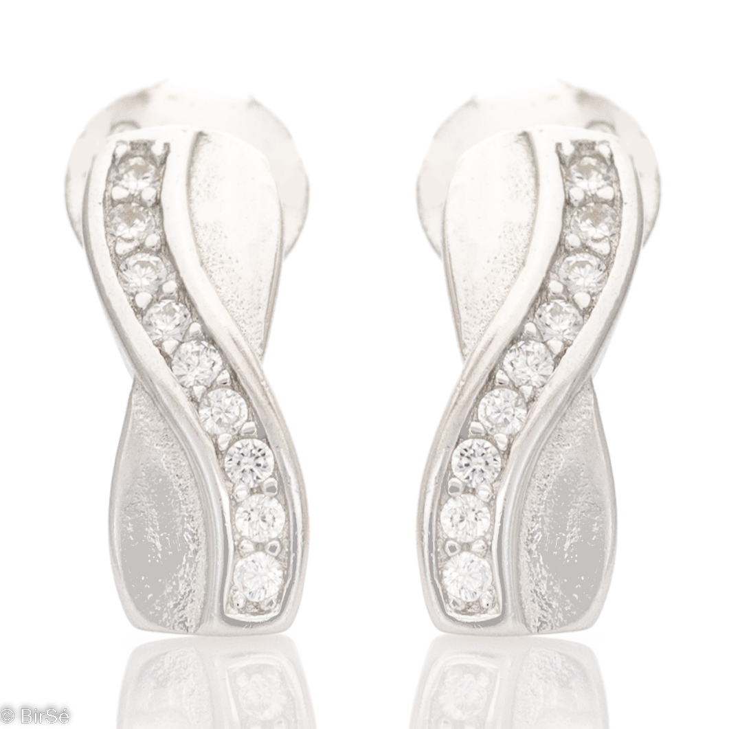 A charming model of ladies' earrings made of elegant rhodium-plated silver with a spectacular design. The earrings have a convenient and secure pin fastening.