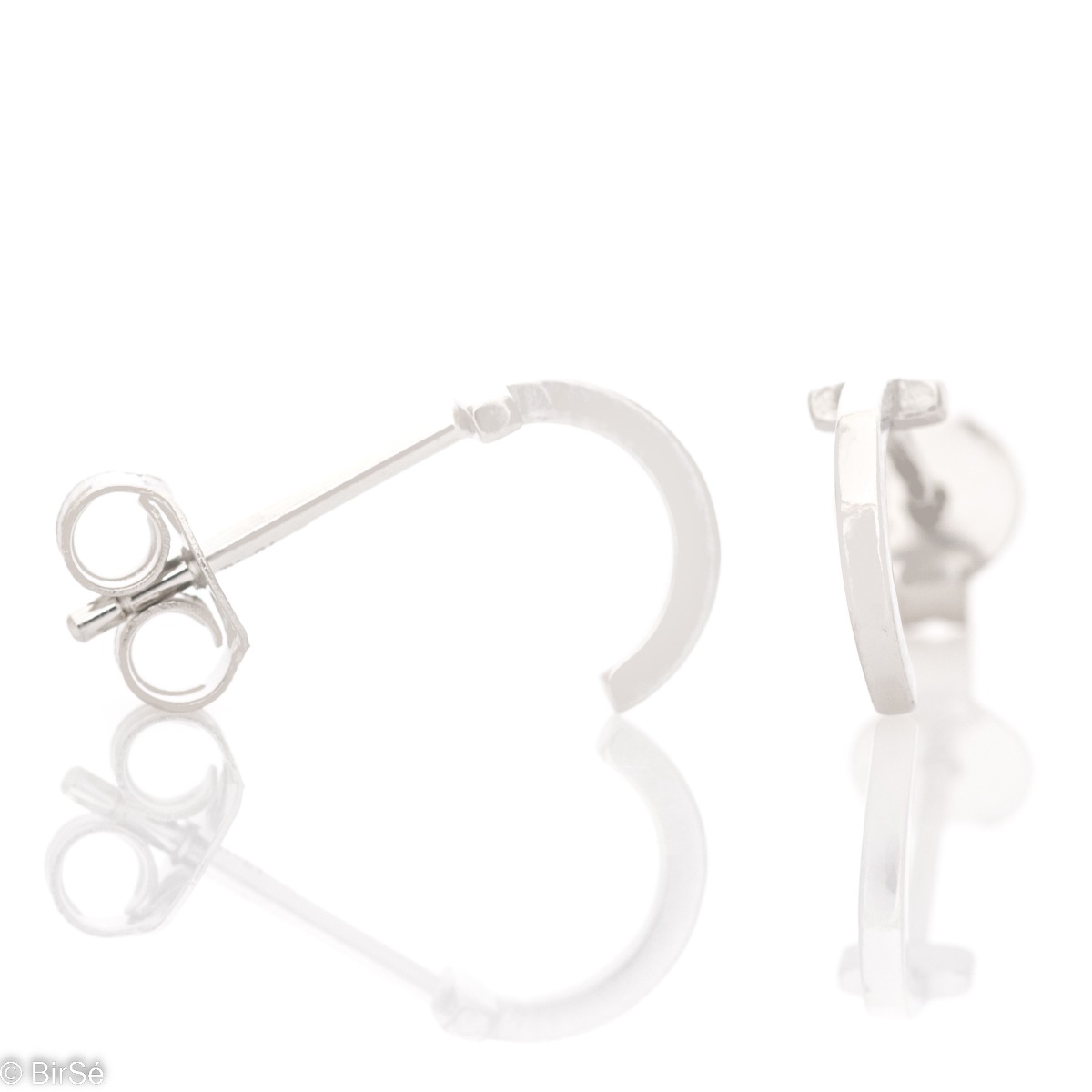 Simple earrings made with an elegant rhodium silver element design in the shape of a small arc. The fastening is with a pin - secure and preferred by the ladies. They can be worn as a second earring.