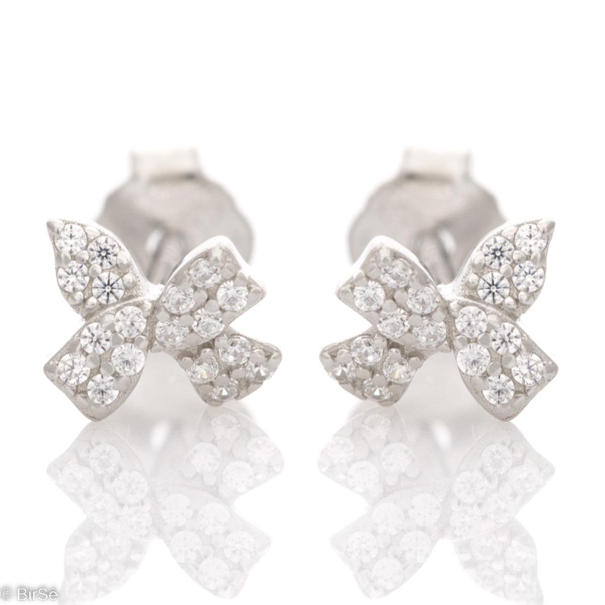 Delicate silver earrings with a ribbon shape and a pin fastening. Shiny zircons elegantly decorate the earrings, attracting the eyes of young and old ladies.