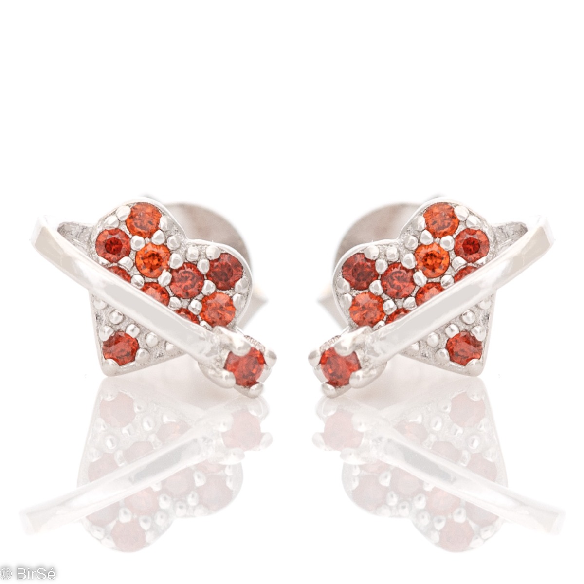 Small spectacular earrings made of classic rhodium-plated silver - a heart with colored zircons. Simple and elegant, the earrings can be combined with other zircon jewelry.