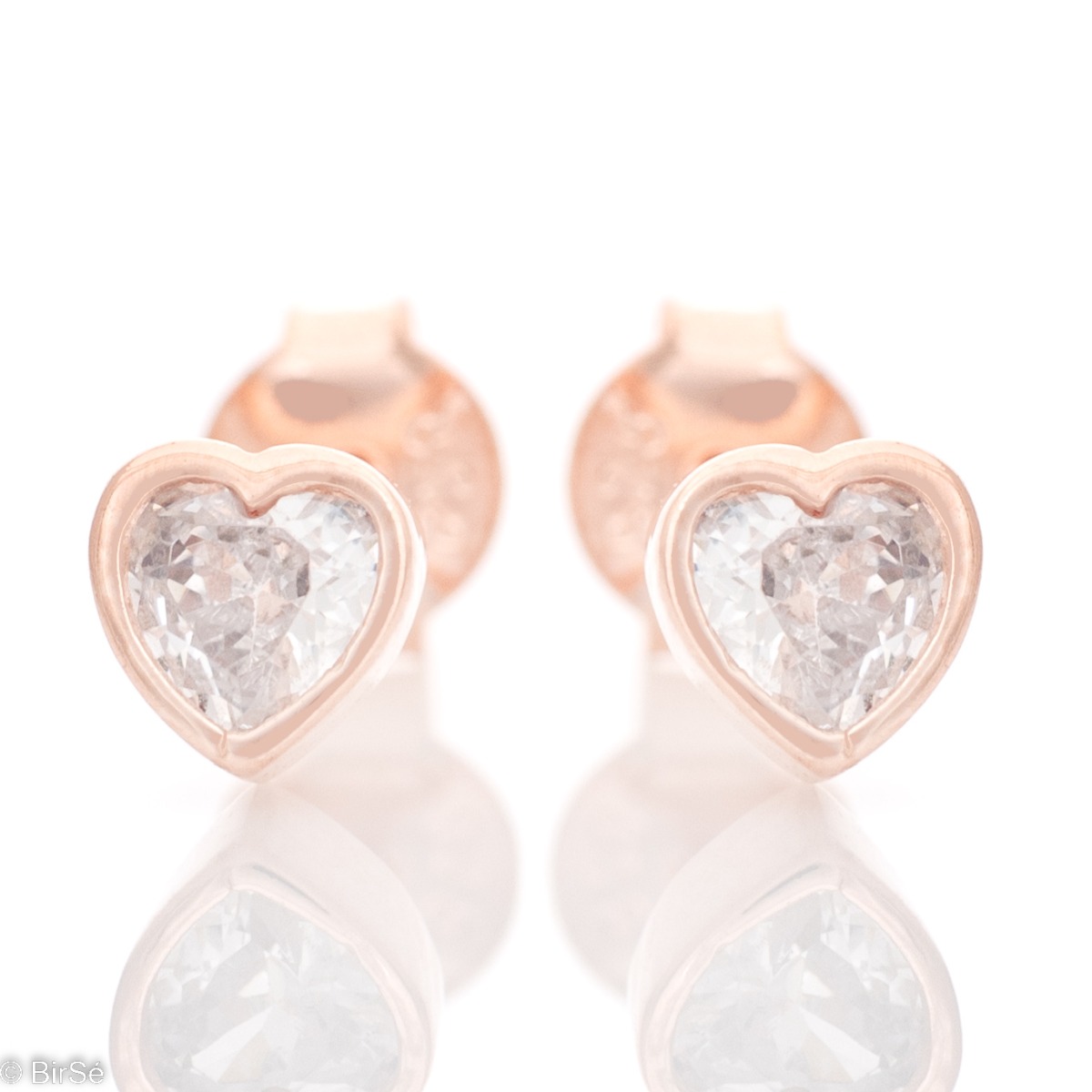 Delicate hearts surrounding a sparkling zircon - our new women's stud earrings with precision craftsmanship entirely in rhodium-plated rose silver. Suitable for small and large ladies.