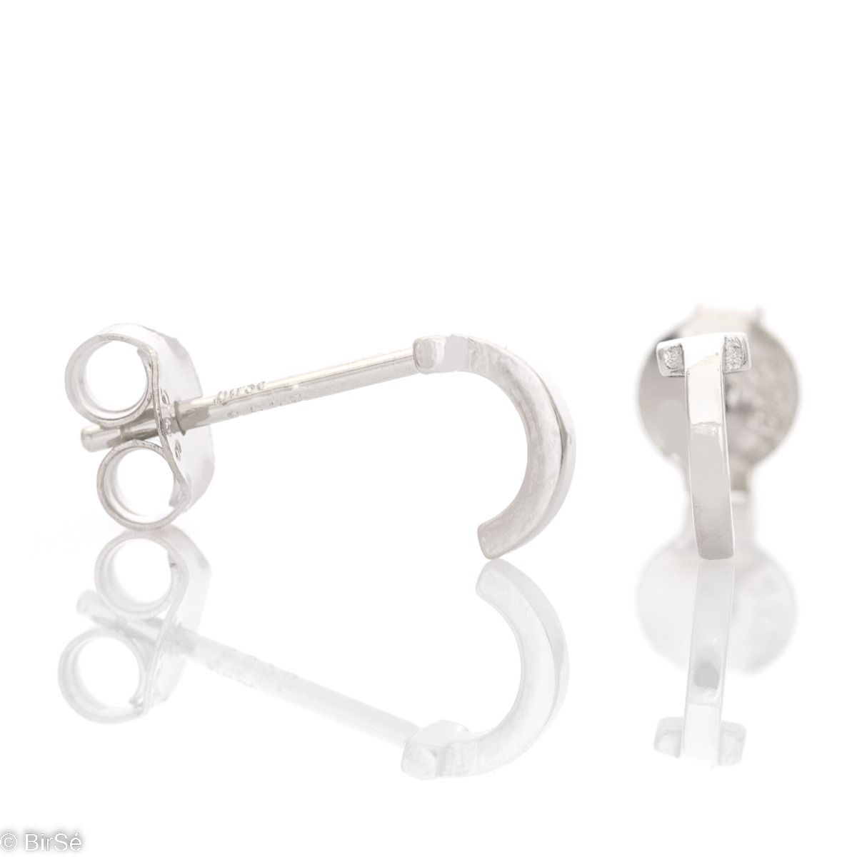 Simple earrings made with an elegant rhodium silver element design in the shape of a small arc. The fastening is with a pin - secure and preferred by the ladies. They can be worn as a second earring.