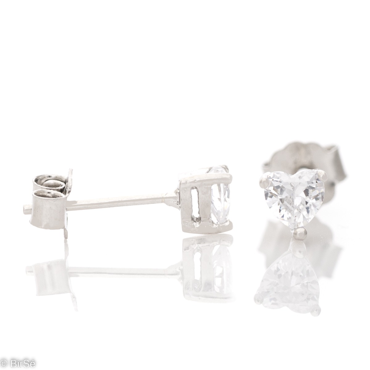 Exquisite earrings made of fine silver in the shape of a heart, in a delicate combination with an enchanted zircon. Fastening with a pin is for more convenience, and the earrings are a suitable gift for the beloved girl.