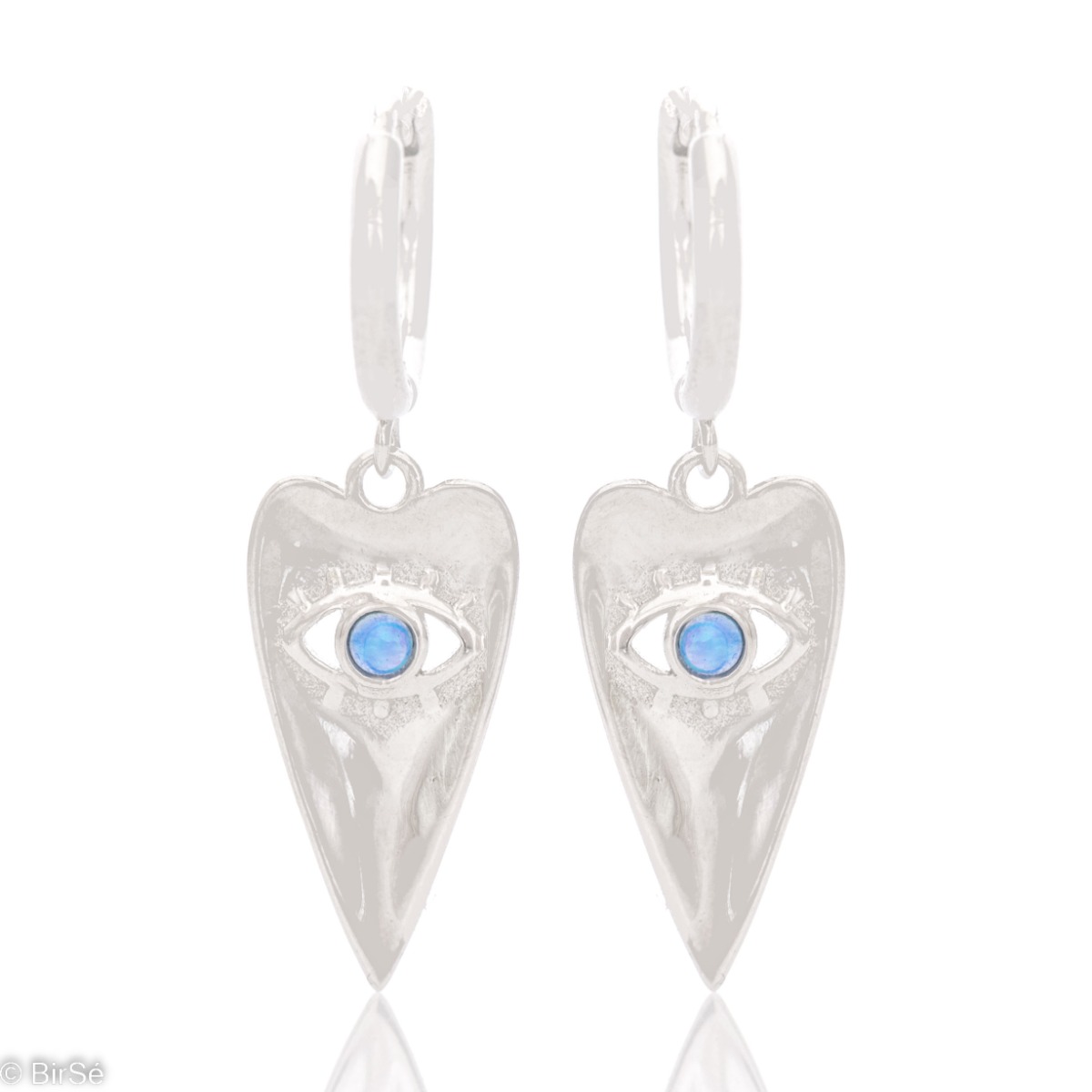 Spectacular rhodium silver earrings with a mystical look. An elongated heart-shaped tile cozily houses the all-seeing eye of Ra, decorated with fine turquoise.