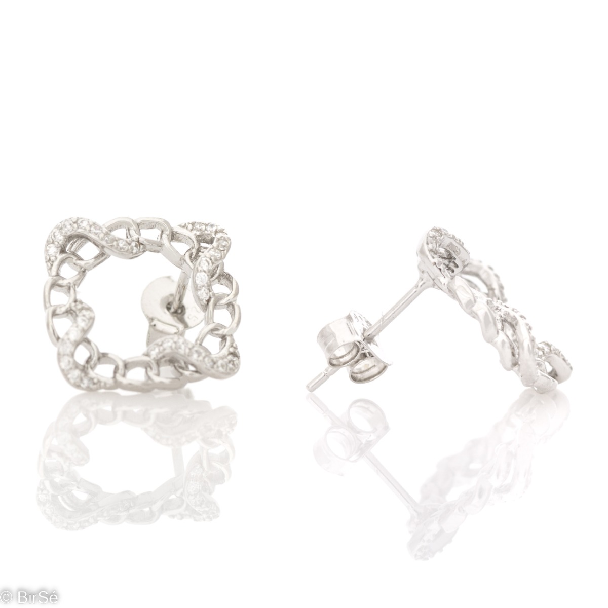 Charming women's stud earrings, elegantly shaped as a beautiful tangle of fine rhodium silver and sparkling zircons. Earrings suitable for every day and occasion.