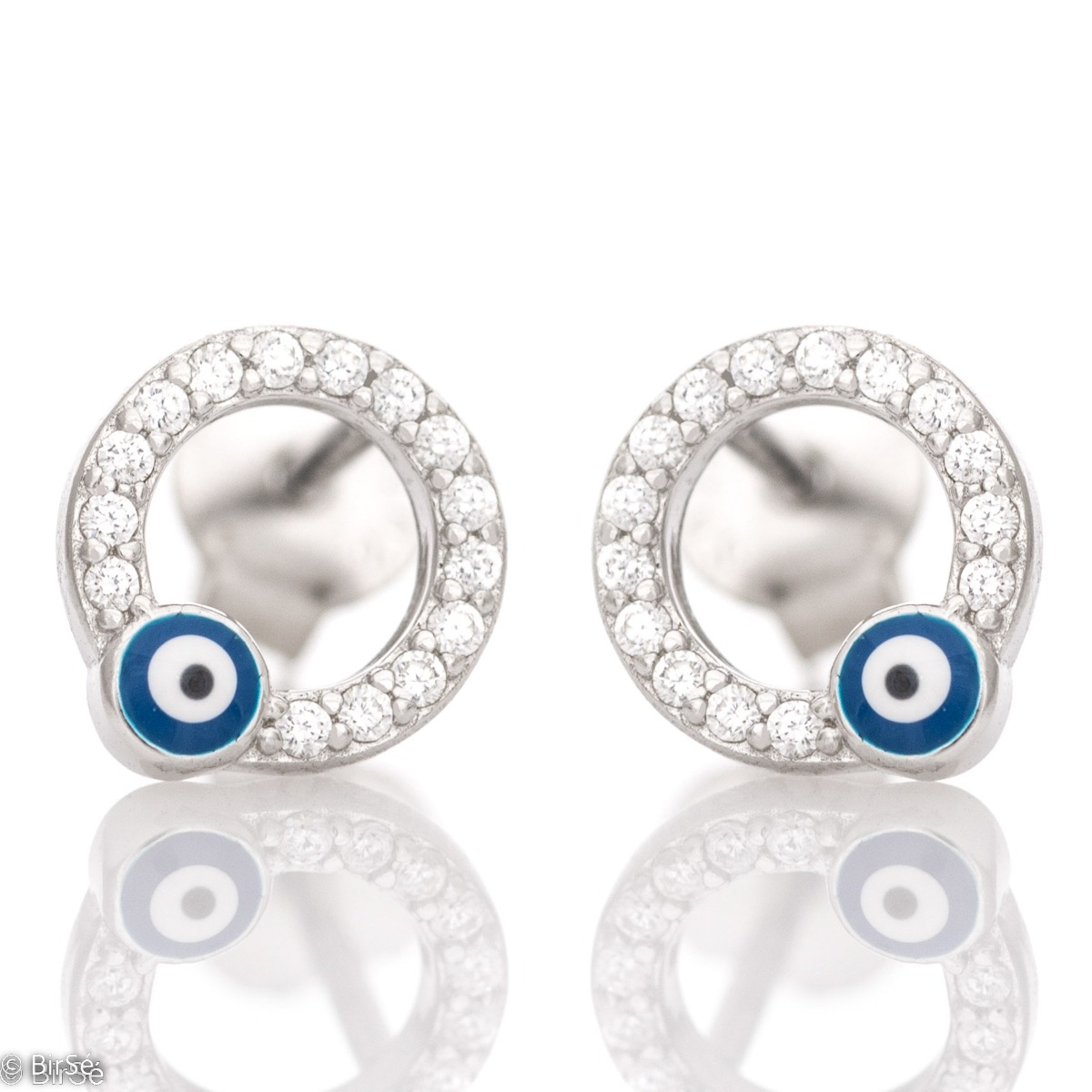 Elegantly crafted women's earrings in delicate rhodium silver with a circle shape and a coating of dazzling zircons. A small blue eye is the different accent in the earrings, which feature a comfortable pin fastening.