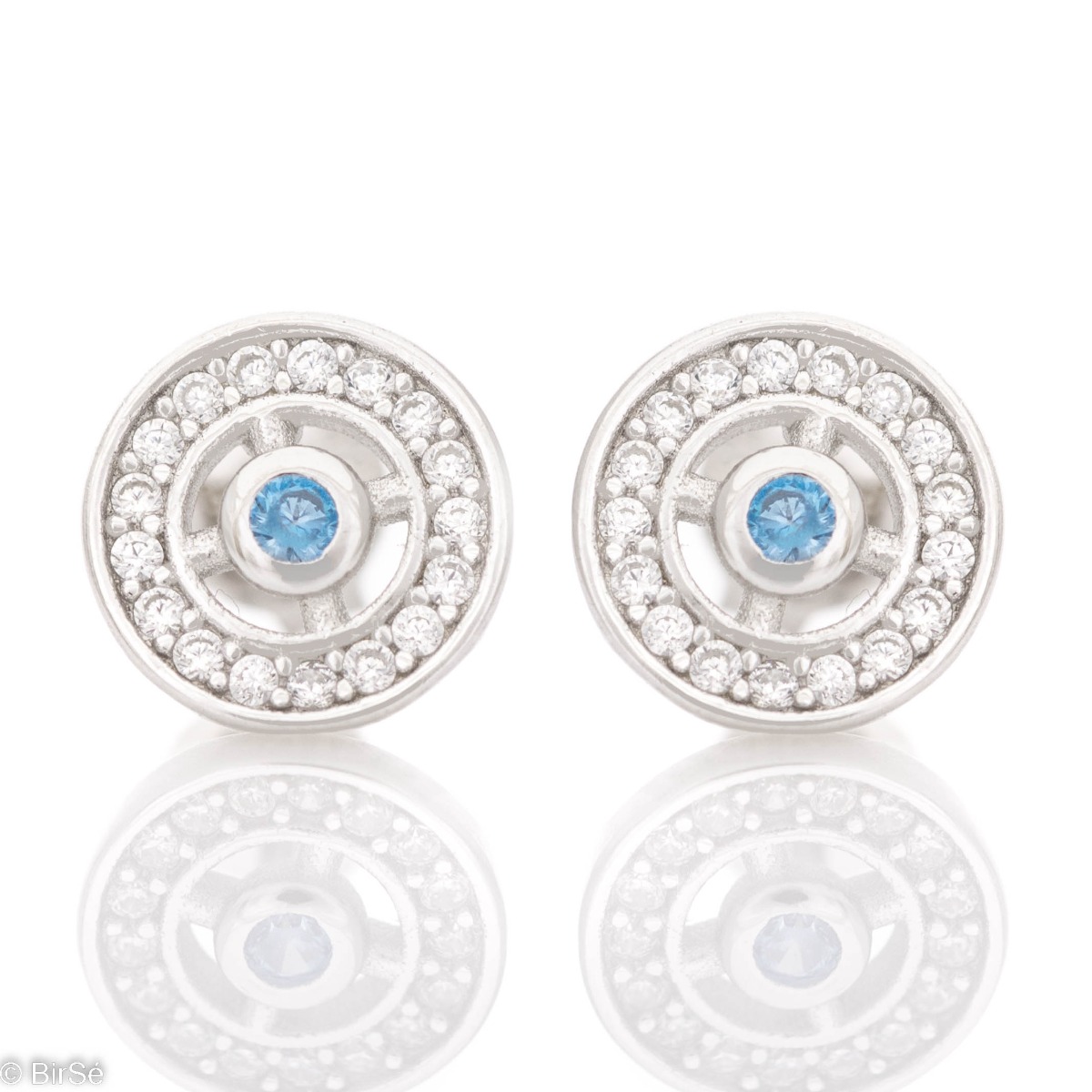 Charming women's earrings, masterfully crafted from fine rhodium silver with an elegant blue stone in the center. The elements are beautifully sculpted, dazzling zircons sparkle charmingly, and the pin fastening is comfortable and practical.