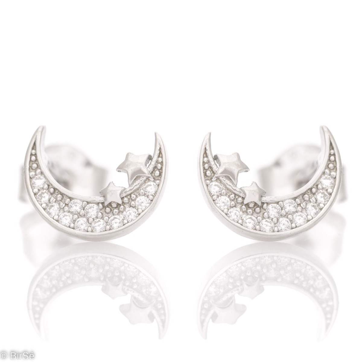 Small earrings in fine rhodium-plated silver with the appearance of a moon and stars. The earrings have a pin fastening and are suitable for all ages.