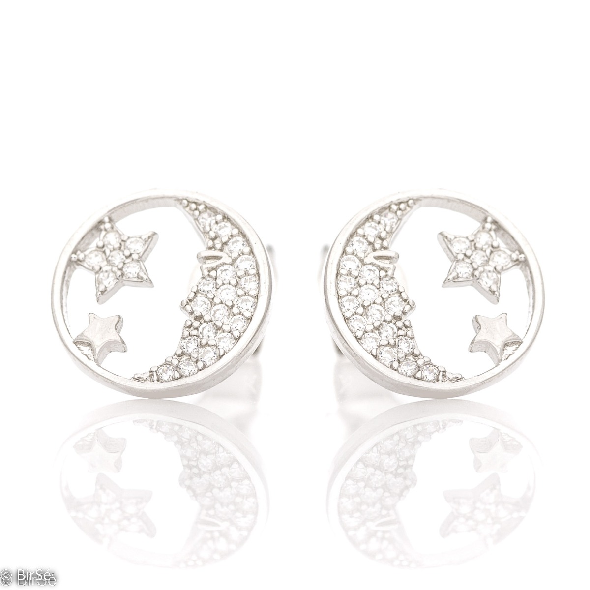 Small earrings in fine rhodium silver with moon and stars. The earrings have a pin fastening and are suitable for all ages. The added zircons make the elements even more charming and glamorous.