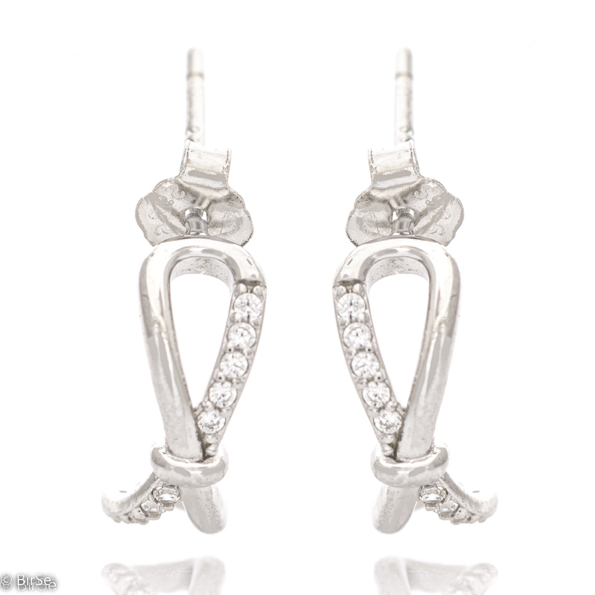 A charming model of ladies' earrings made of elegant rhodium-plated silver with a spectacular design. The earrings have a convenient and secure pin fastening. The added zircons make the elements even more charming and glamorous.