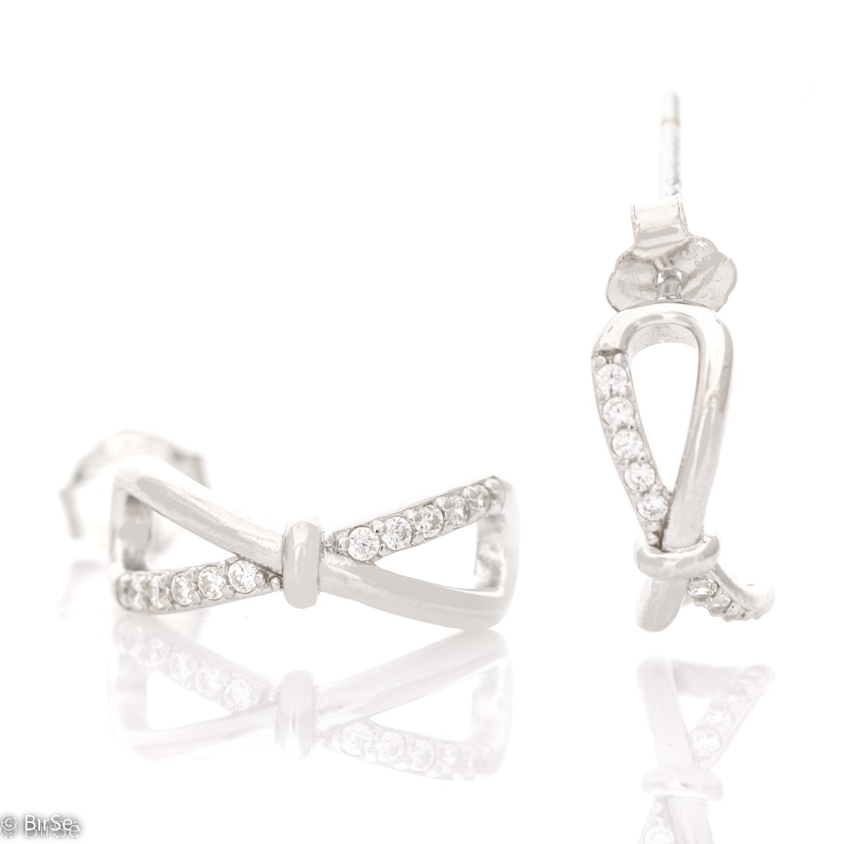 A charming model of ladies' earrings made of elegant rhodium-plated silver with a spectacular design. The earrings have a convenient and secure pin fastening. The added zircons make the elements even more charming and glamorous.