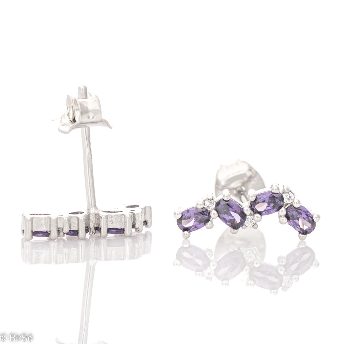 Fine silver earrings with an elegant pattern. Beautiful soft purple zircons are the main accent of the earrings, made with a pin fastening and suitable for ladies of all ages.