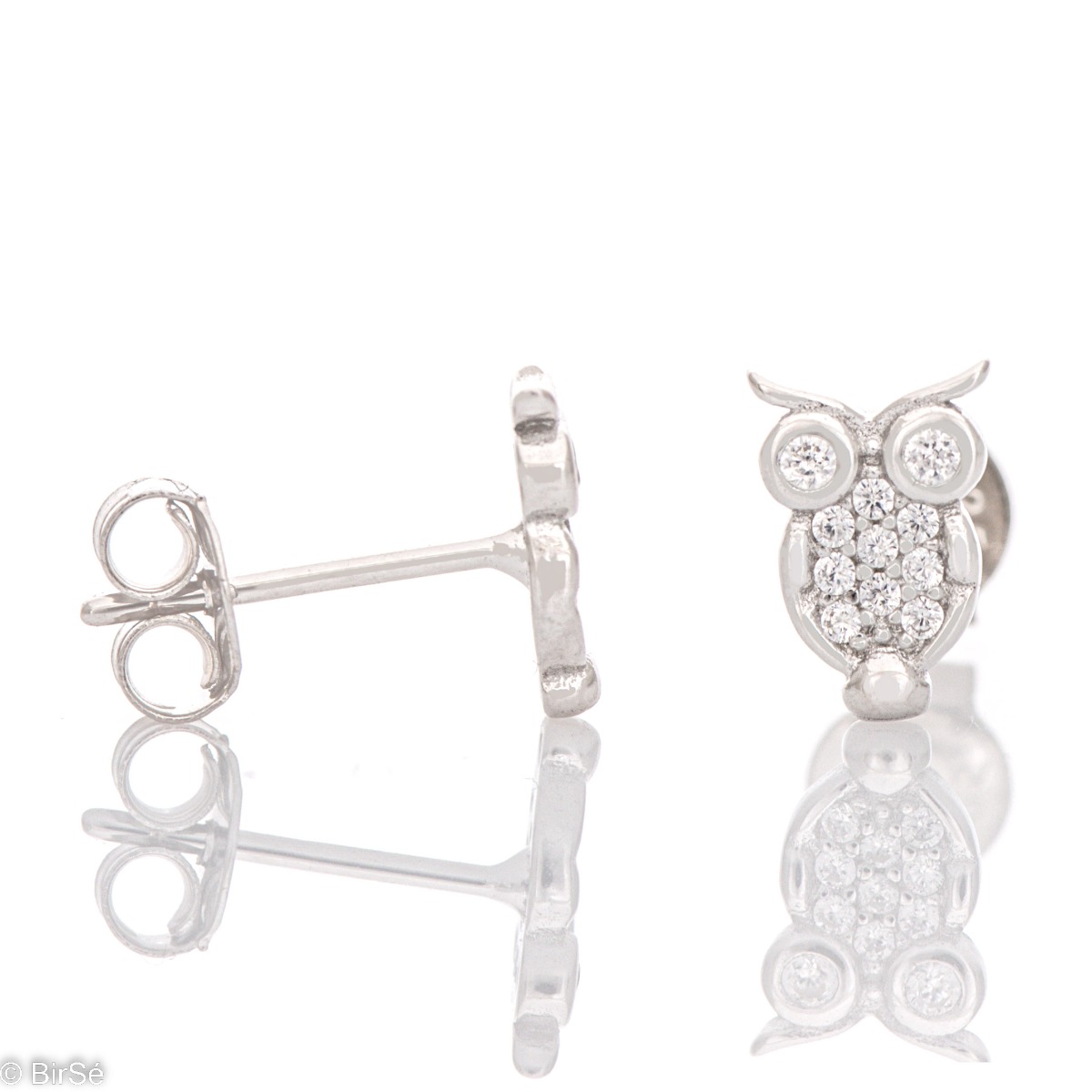 Charming owl earrings elegantly crafted from glittering rhodium silver. The beautiful silver is in the company of fine zircons and together they form delicate earrings that are suitable for little and big girls.