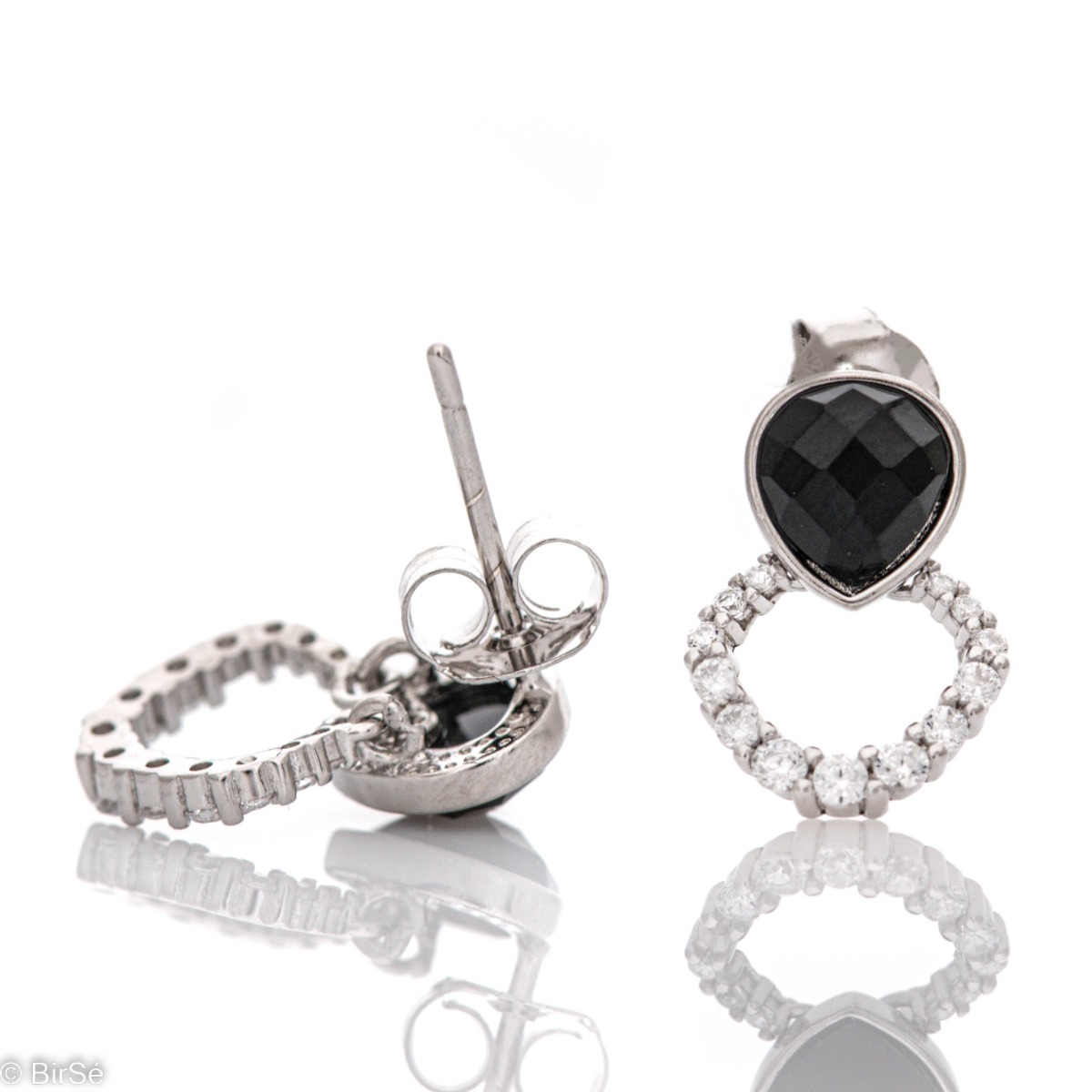 Fine sterling silver stud earrings with precision craftsmanship entirely in rhodium-plated silver and elements encrusted with sparkling zircons paired with captivating onyx.