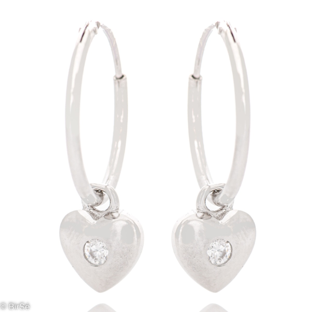 Elegant ladies hoop earrings made of fine rhodium silver with heart pendants.