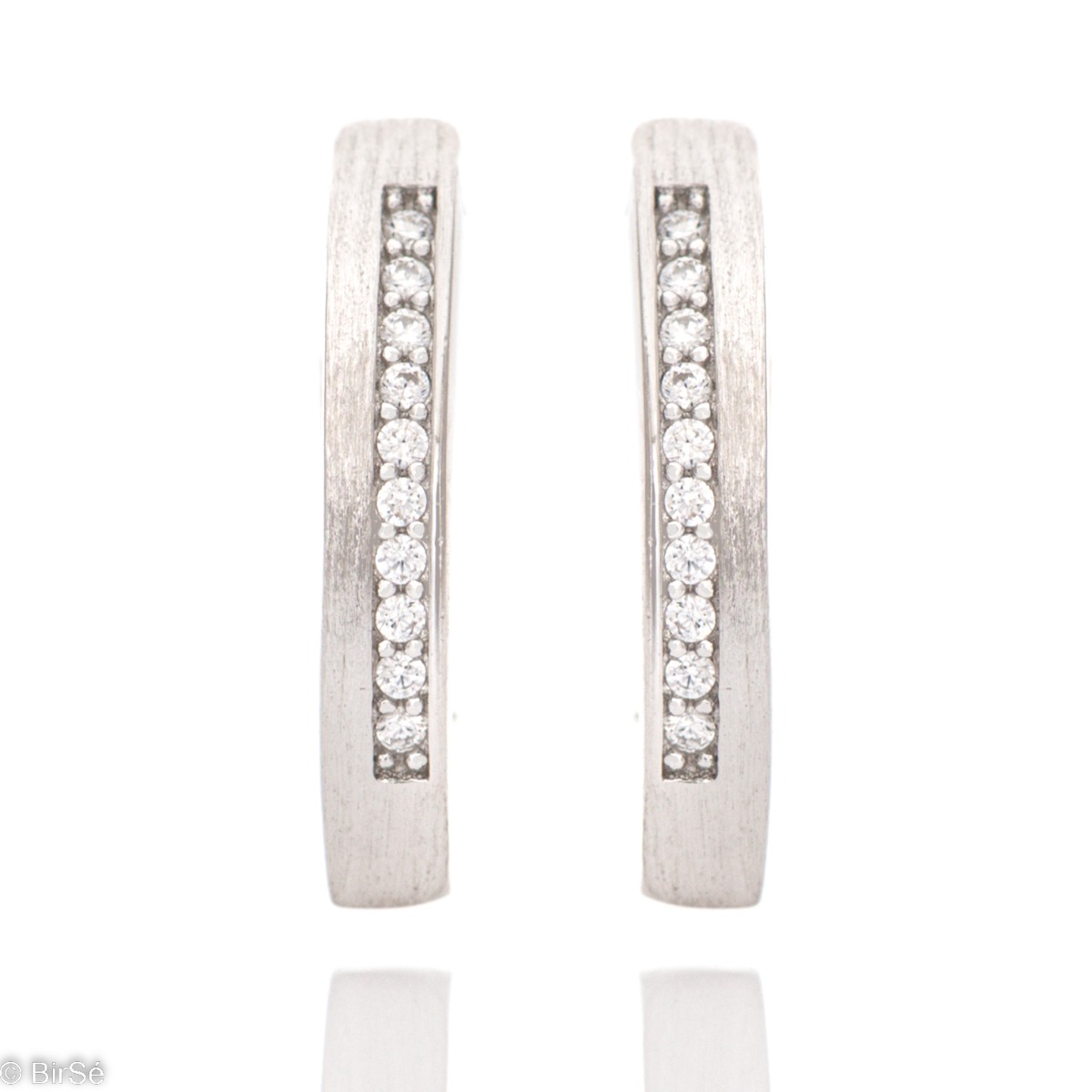 Women's model of silver earrings, made with an elegant design and matte finish. The added row of zircons gives the jewelry a spectacular shine, and the English clasp is comfortable and preferred by the ladies.