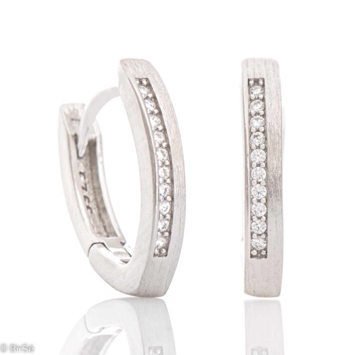 Women's model of silver earrings, made with an elegant design and matte finish. The added row of zircons gives the jewelry a spectacular shine, and the English clasp is comfortable and preferred by the ladies.