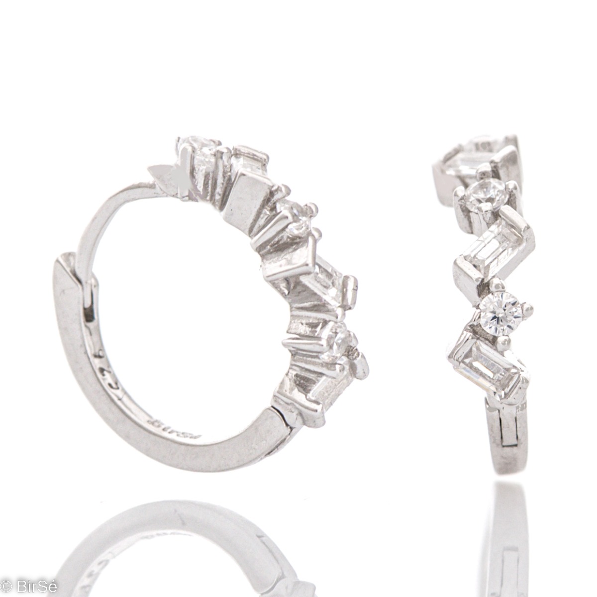 Spectacular hoop earrings made of elegant rhodium-plated silver in combination with sparkling zircons of different sizes and shapes. The earrings are suitable for children and ladies.