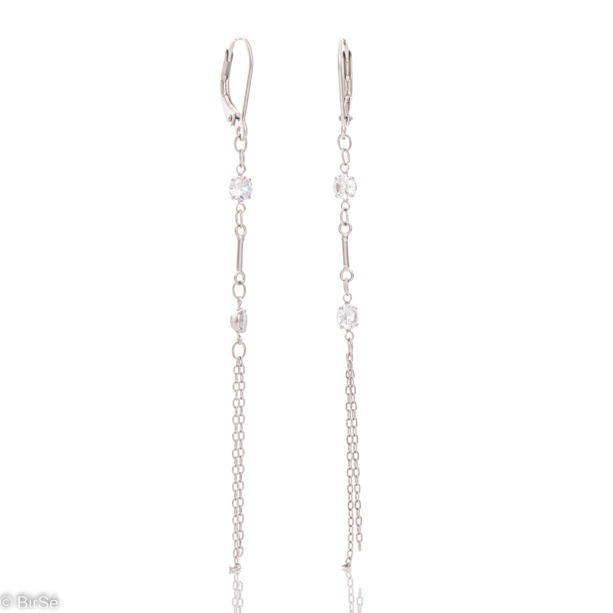 Charming dangling earrings in fine rhodium silver, with delicate chains decorated with zircons. Willow fastening - comfortable and practical for ladies. Suitable for your everyday life.