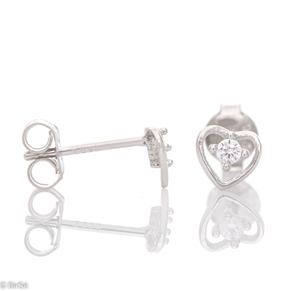 Spectacular ladies' earrings in rhodium-plated silver in the shape of a heart, decorated with a dazzling cubic zirconia. The earrings have a convenient pin fastening, suitable for little girls.