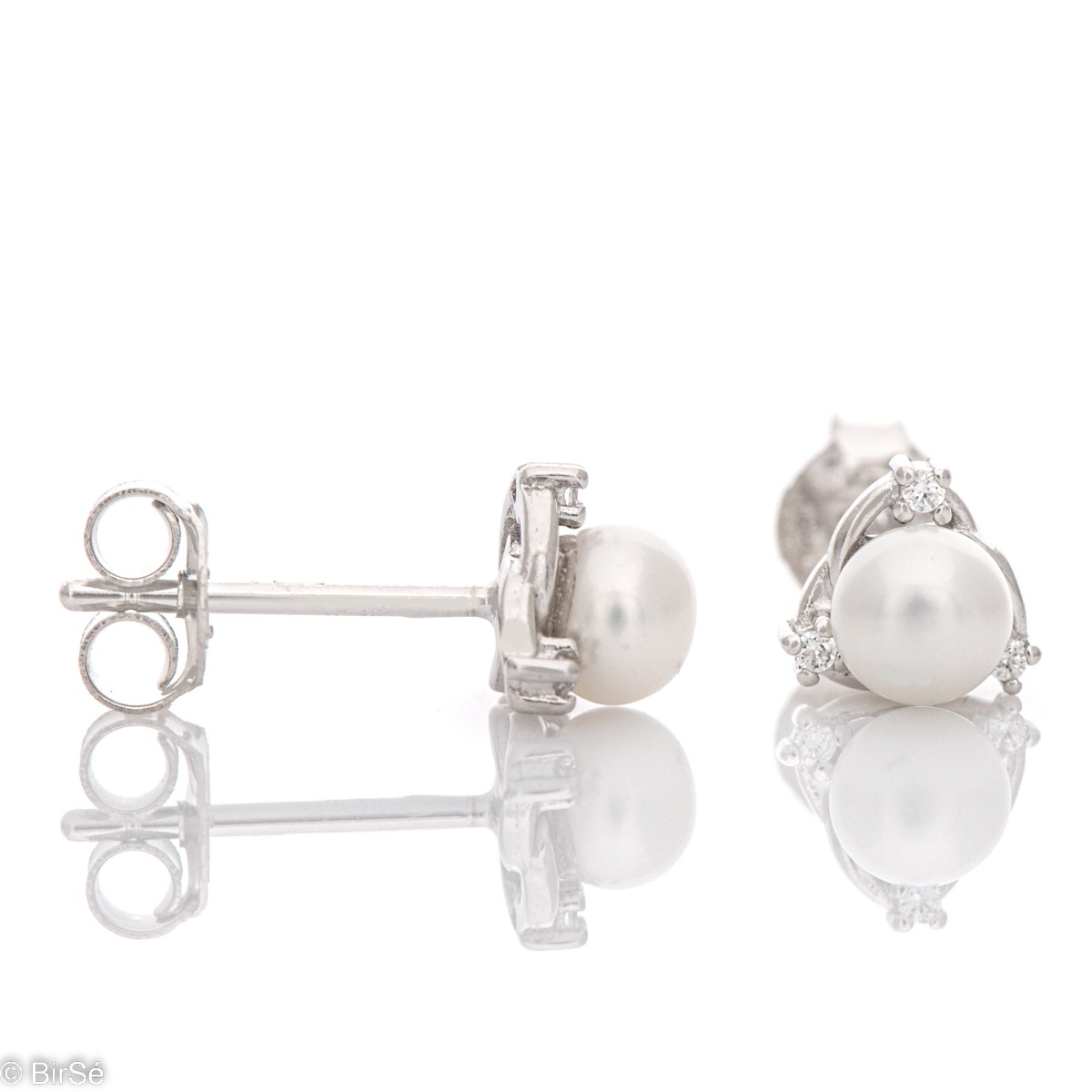 Stylish women's earrings, exquisitely crafted from fine rhodium silver. A captivating natural pearl is at the heart of the earrings, elegantly combined with sparkling zircons. A suitable piece of jewelry for your special moments.