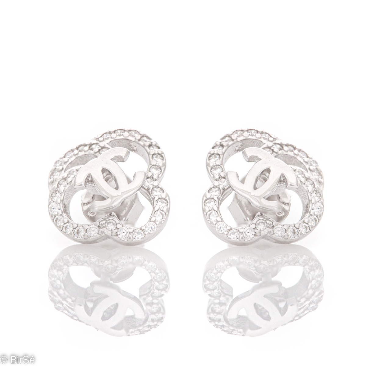 Modern design of silver earrings, combining two models in one with the possibility of wearing separately. Fine silver and sparkling zircons give a special charm to the jewelry.