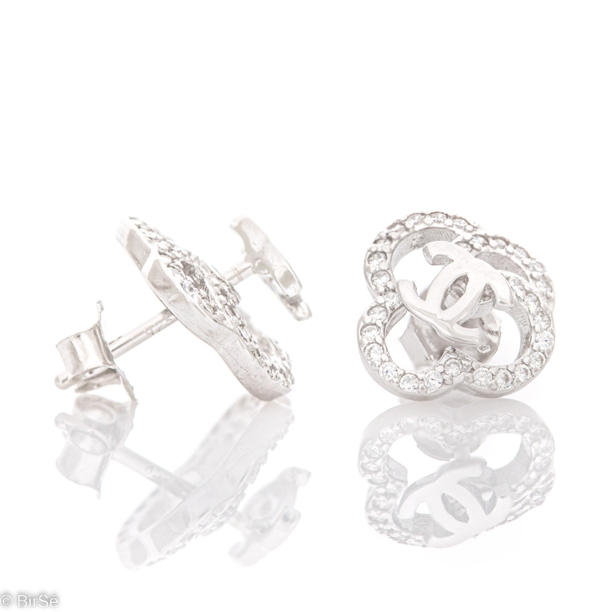 Modern design of silver earrings, combining two models in one with the possibility of wearing separately. Fine silver and sparkling zircons give a special charm to the jewelry.