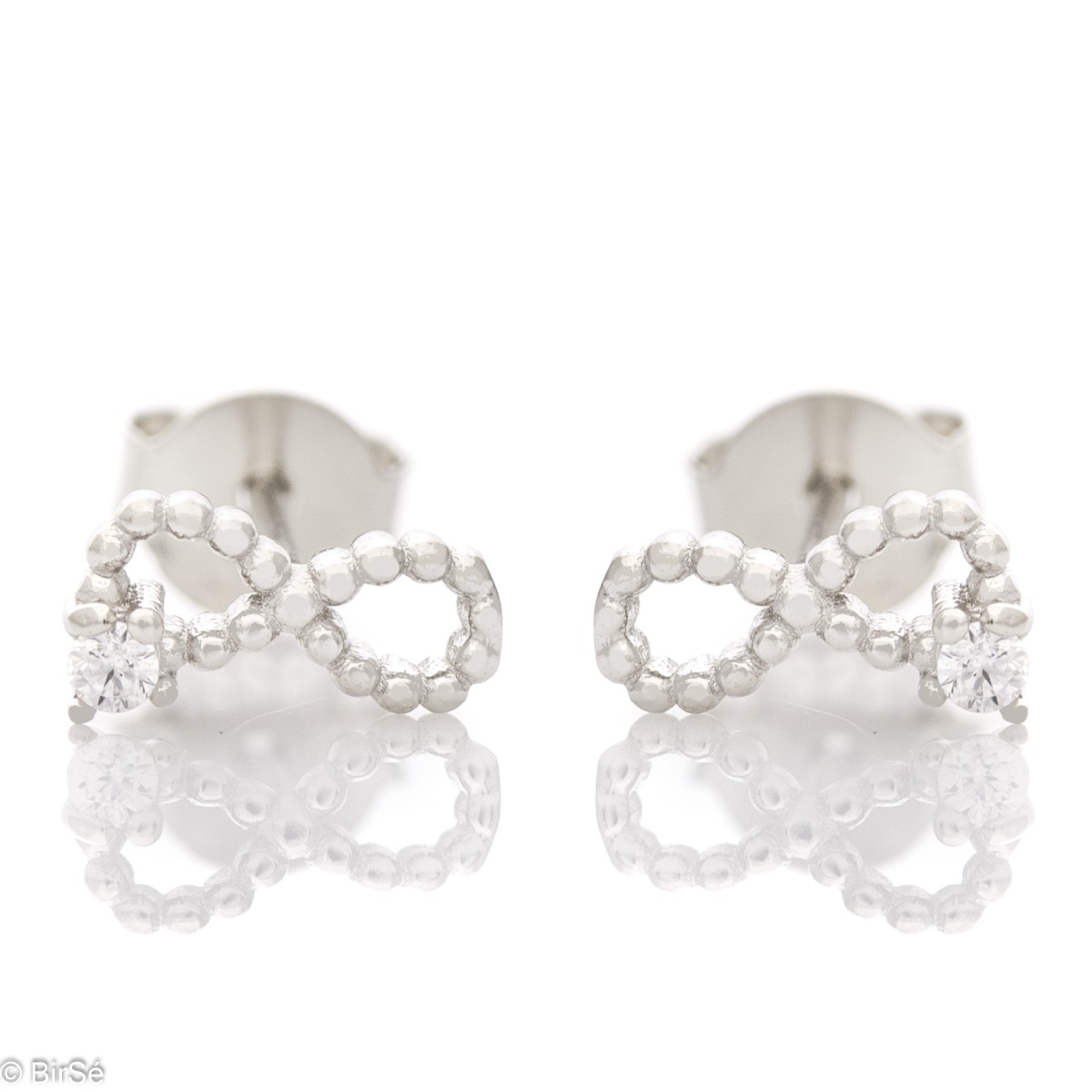 Charming women's earrings, exquisitely crafted through fine silver elements and the glamorous participation of a small zircon. The fastening is with a pin. Earrings are a beautiful proposal for a gift to a beloved woman.