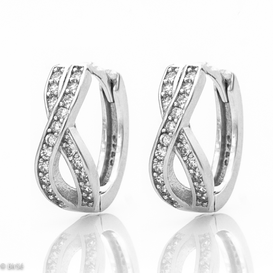 Delicate ladies' earrings made of rhodium-plated silver with a comfortable English clasp. The front side of the earrings is shaped like an exquisite infinity, carefully decorated with zircons. Suitable for ladies of all ages due to the secure fastening.