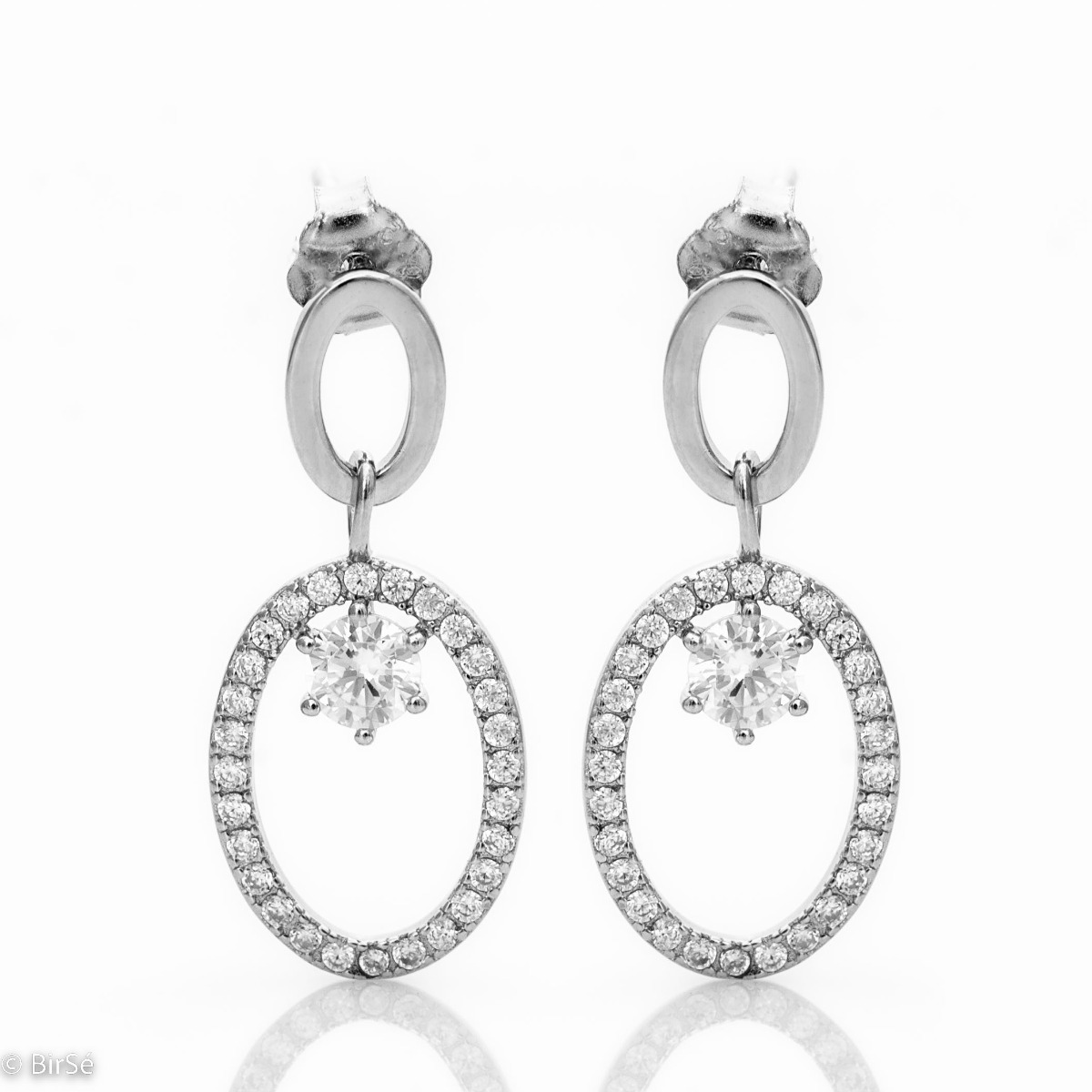 Modern style of women's dangle earrings made of fine rhodium silver combined with small sparkling zircons. The earrings are fastened with a pin, for a better look. An elegant gift for a beloved woman.