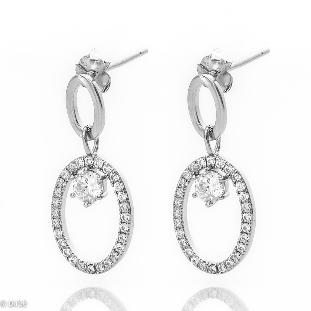 Modern style of women's dangle earrings made of fine rhodium silver combined with small sparkling zircons. The earrings are fastened with a pin, for a better look. An elegant gift for a beloved woman.