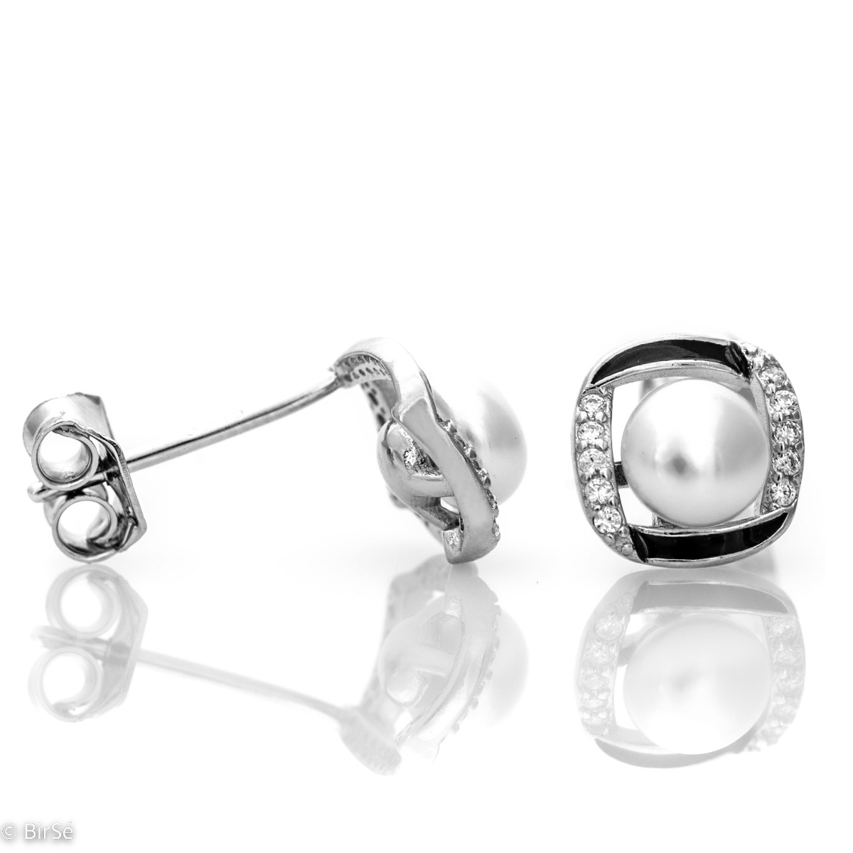 Elegantly crafted women's earrings, stylishly crafted from rhodium-plated silver in combination with a delicate pearl, zircons and black enamel to enhance the effect. The earrings have a comfortable pin fastening. An elegant gift for a beloved woman.