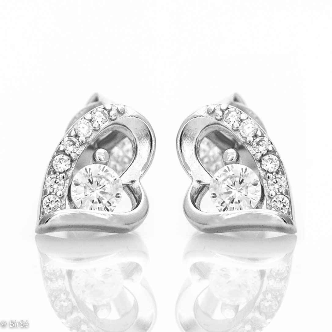 Delicate silver stud earrings with exquisite workmanship all in rhodium silver on a beautiful heart studded with zircons. A lovely gift for a beloved woman. All jewelry is gift-wrapped and accompanied by a certificate of quality and warranty.