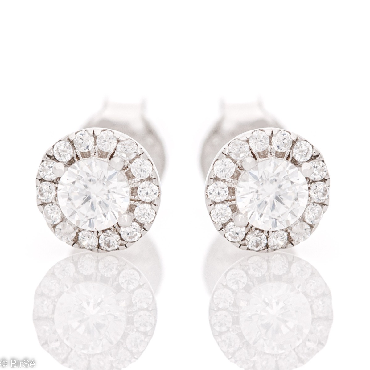 Delicate silver earrings made of rhodium silver with a captivating design. The sparkling zircons adorning the earrings turn them into a charming piece of jewelery desired by ladies. Suitable for all ages, with a comfortable fastening.