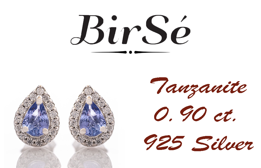 Elegant women's stud earrings with delicate drop-shaped natural tanzanite surrounded by sparkling zircons and exquisitely crafted in beautiful rhodium silver. In a charming ring, necklace and bracelet set.