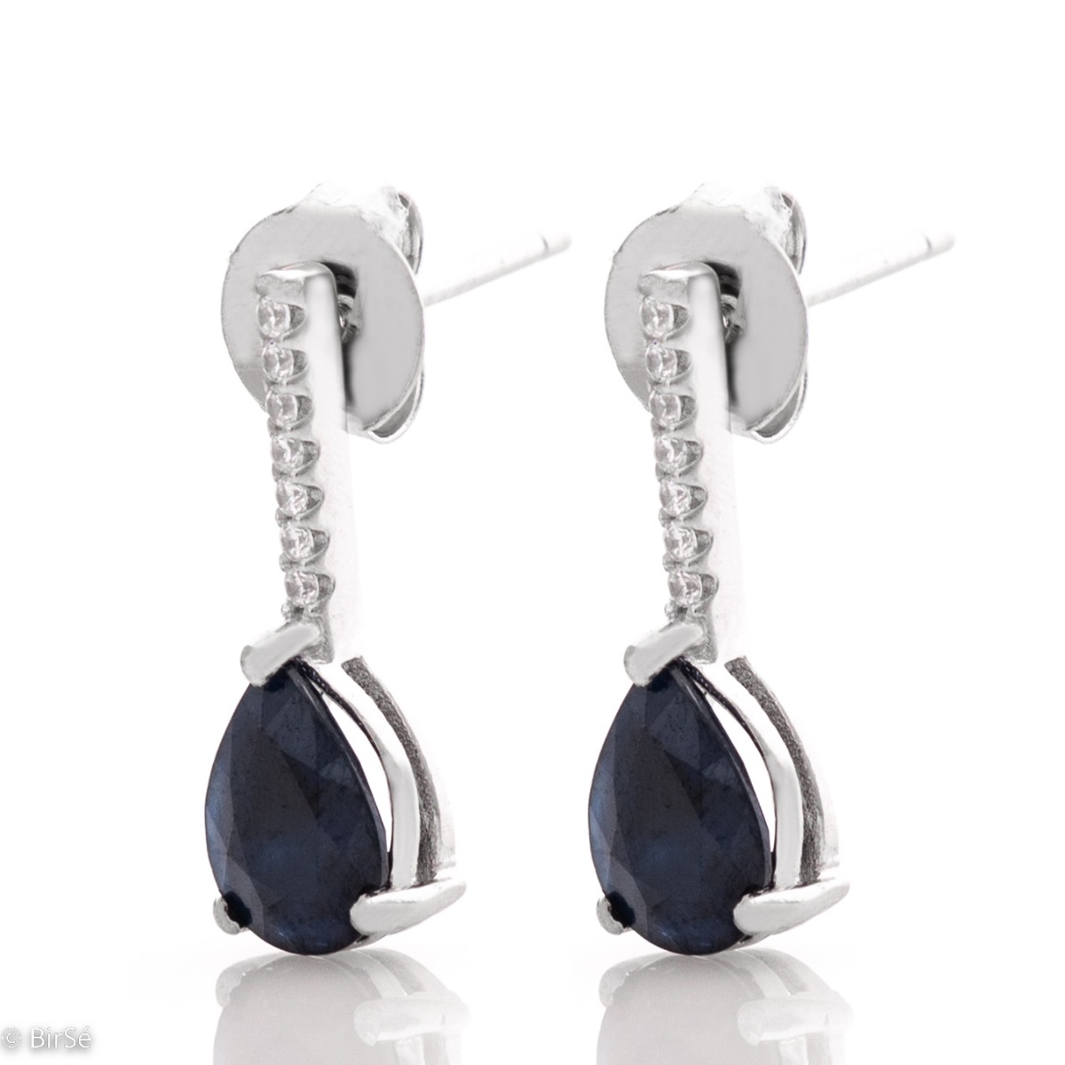 Get an elegant style with rhodium-plated sterling silver and drop-shaped natural sapphire earrings. The added sparkling zircons add extra charm to the jewelry.