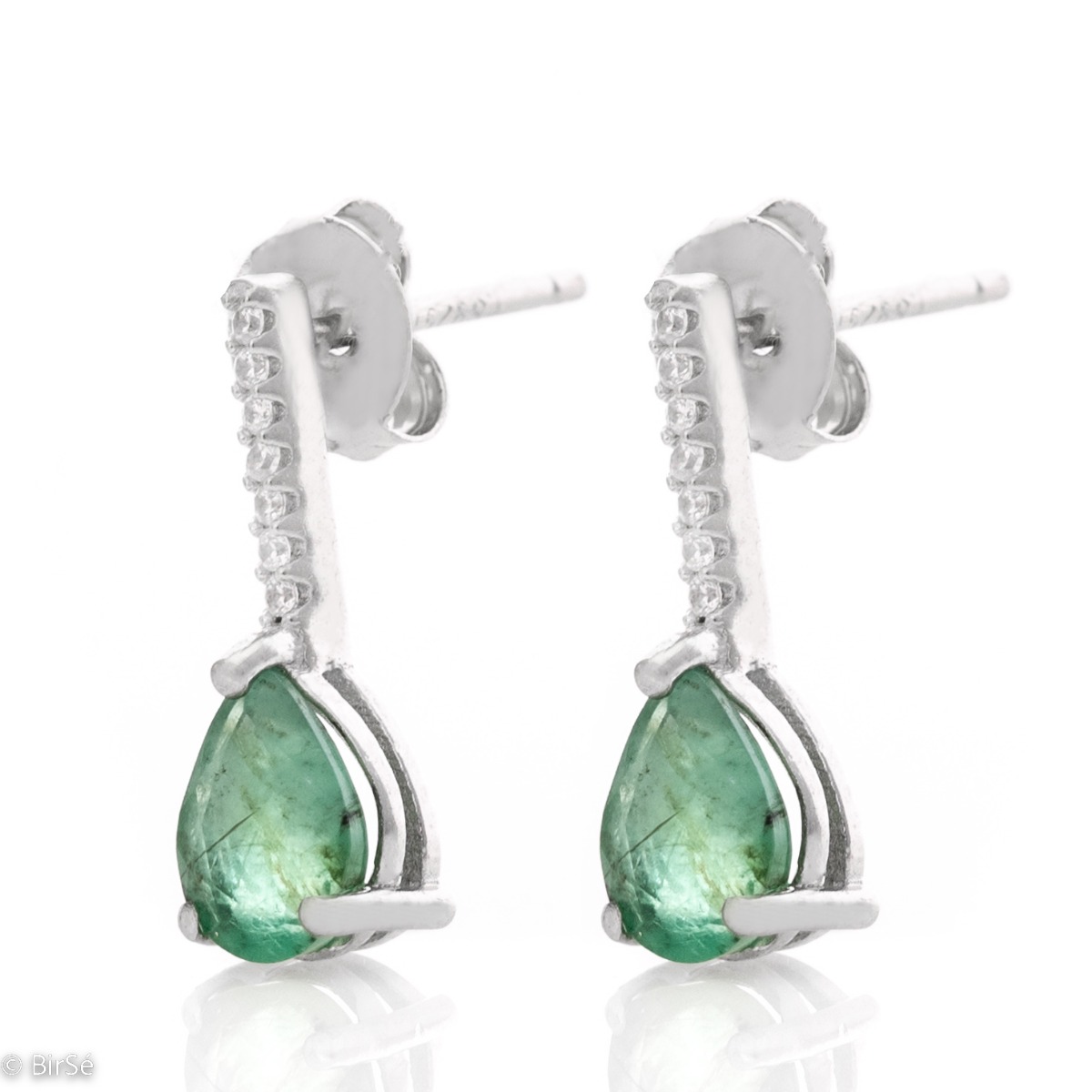 Exquisite women's earrings with a spectacular and radiant combination of a natural emerald stone with fine shiny zircons and delicate workmanship entirely of rhodium-plated silver.