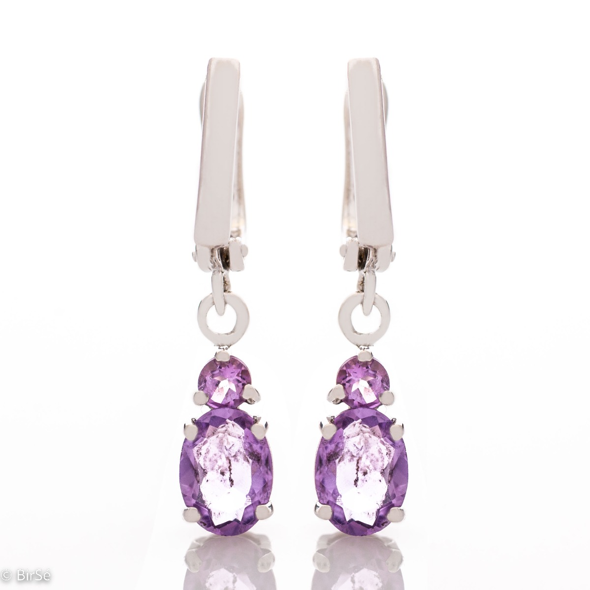 Elegant rhodium silver dangle earrings for every style - these are our magnetic soft purple amethyst earrings. Elegance yourself or a loved one with the complete set, which includes a ring and pendant with the same lovely design.