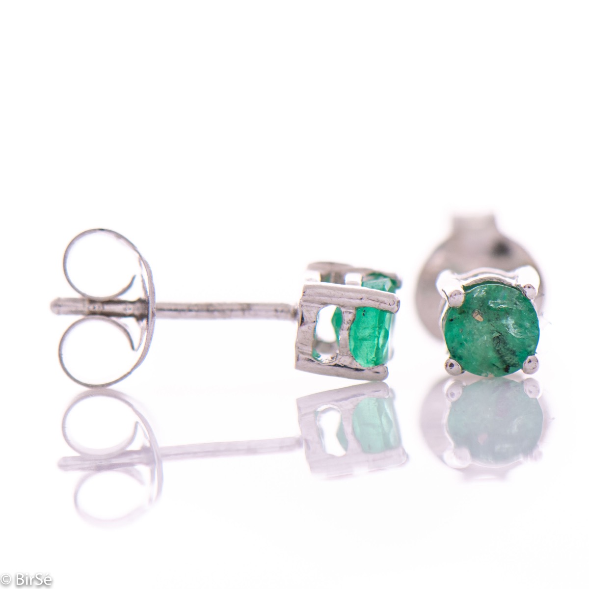 Modern and subtle stud earrings, delicately combining beautiful rhodium silver with a natural emerald stone.