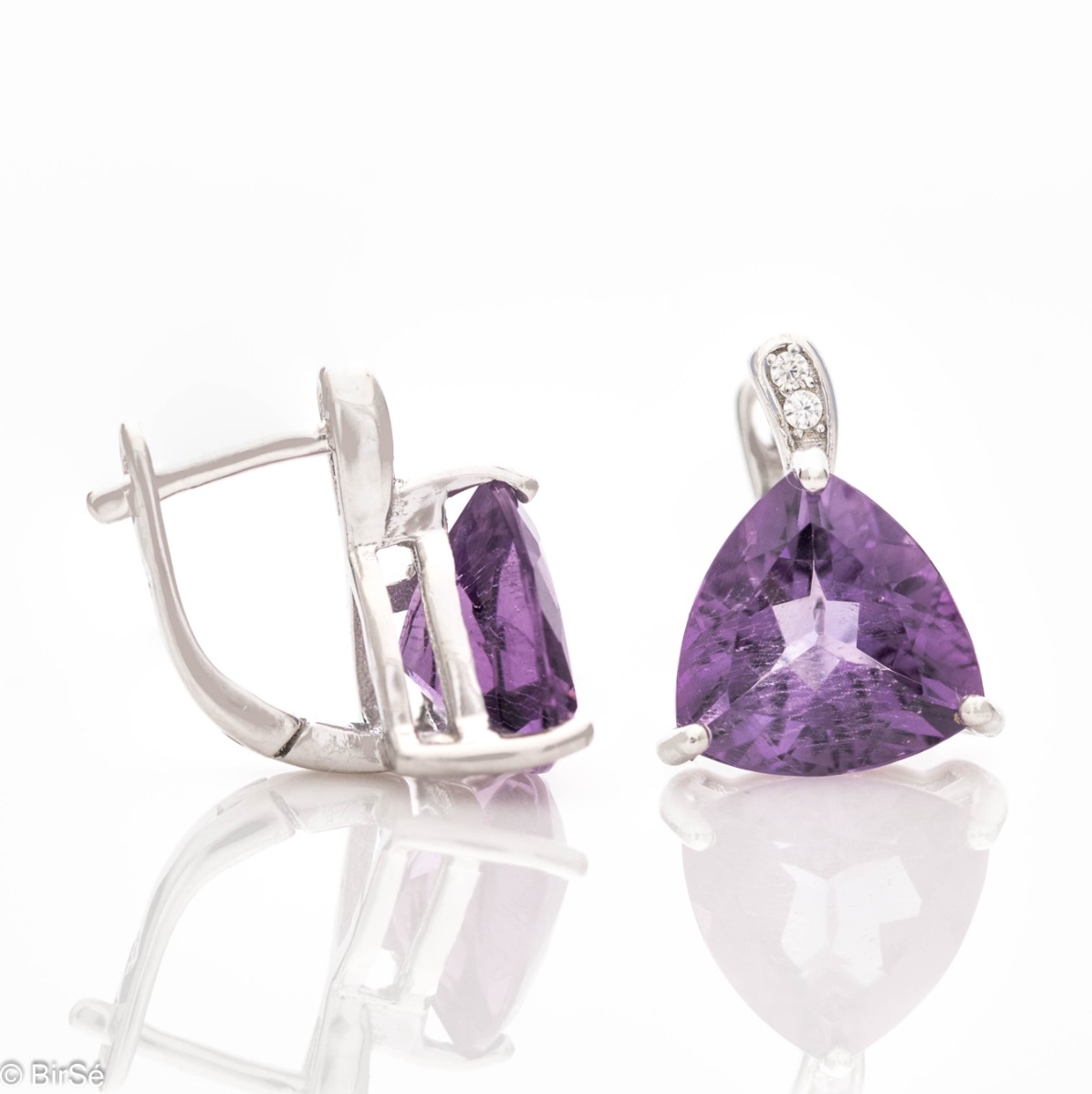 Dainty rhodium silver semi-dangle earrings with natural amethyst and a comfortable English clasp. The beautiful shape and soft purple shine make these earrings a perfect addition to your jewelry collection. You can combine with an elegant ring from the mo