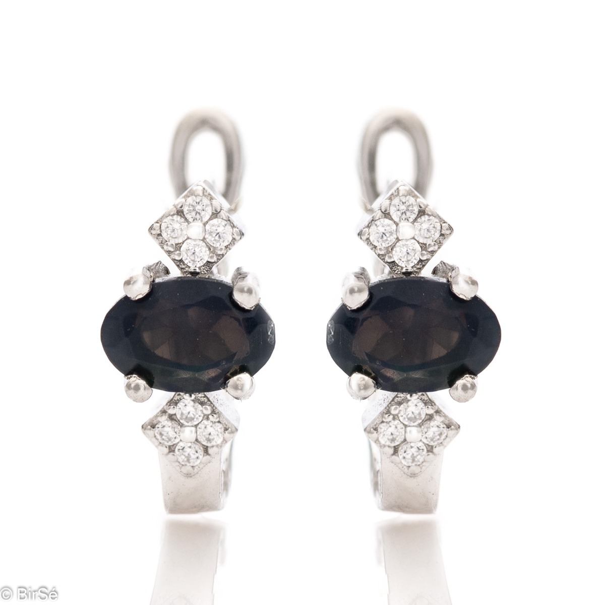 Extremely radiant ladies' English clasp earrings, combining the brilliance of delicate zircons with a natural black opal stone. Complemented with exquisite and fine workmanship entirely in beautiful rhodium-plated silver.