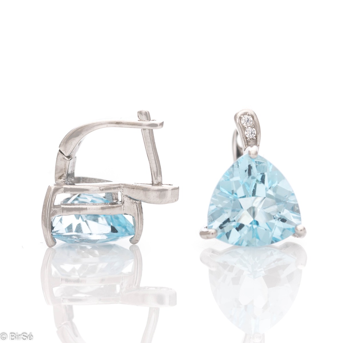 Exquisite rhodium silver semi-dangle earrings with natural blue topaz and a comfortable English clasp. The beautiful shape and dazzling blue sparkle make these earrings a perfect addition to your jewelry collection. You can combine with an elegant ring fr