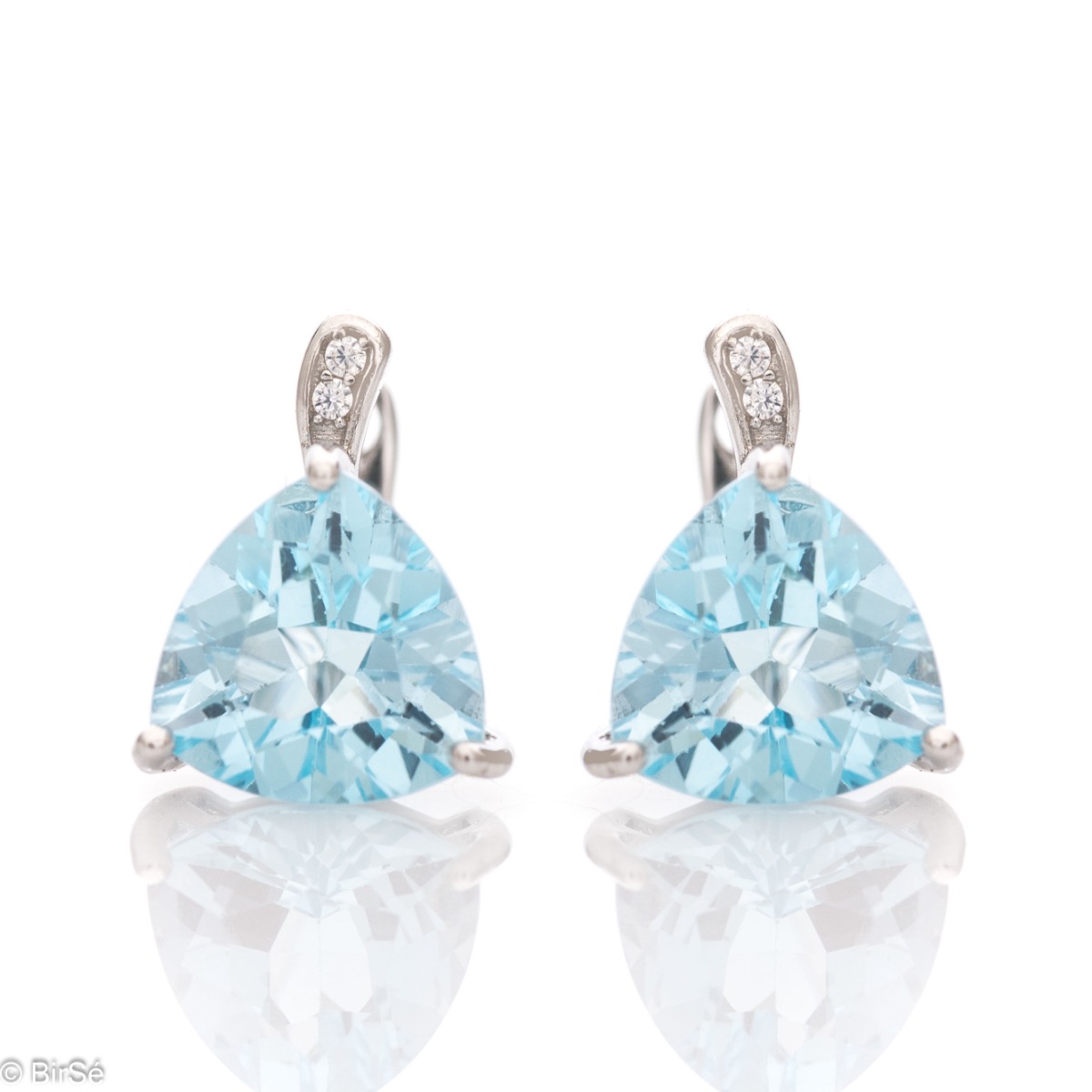 Exquisite rhodium silver semi-dangle earrings with natural blue topaz and a comfortable English clasp. The beautiful shape and dazzling blue sparkle make these earrings a perfect addition to your jewelry collection. You can combine with an elegant ring fr