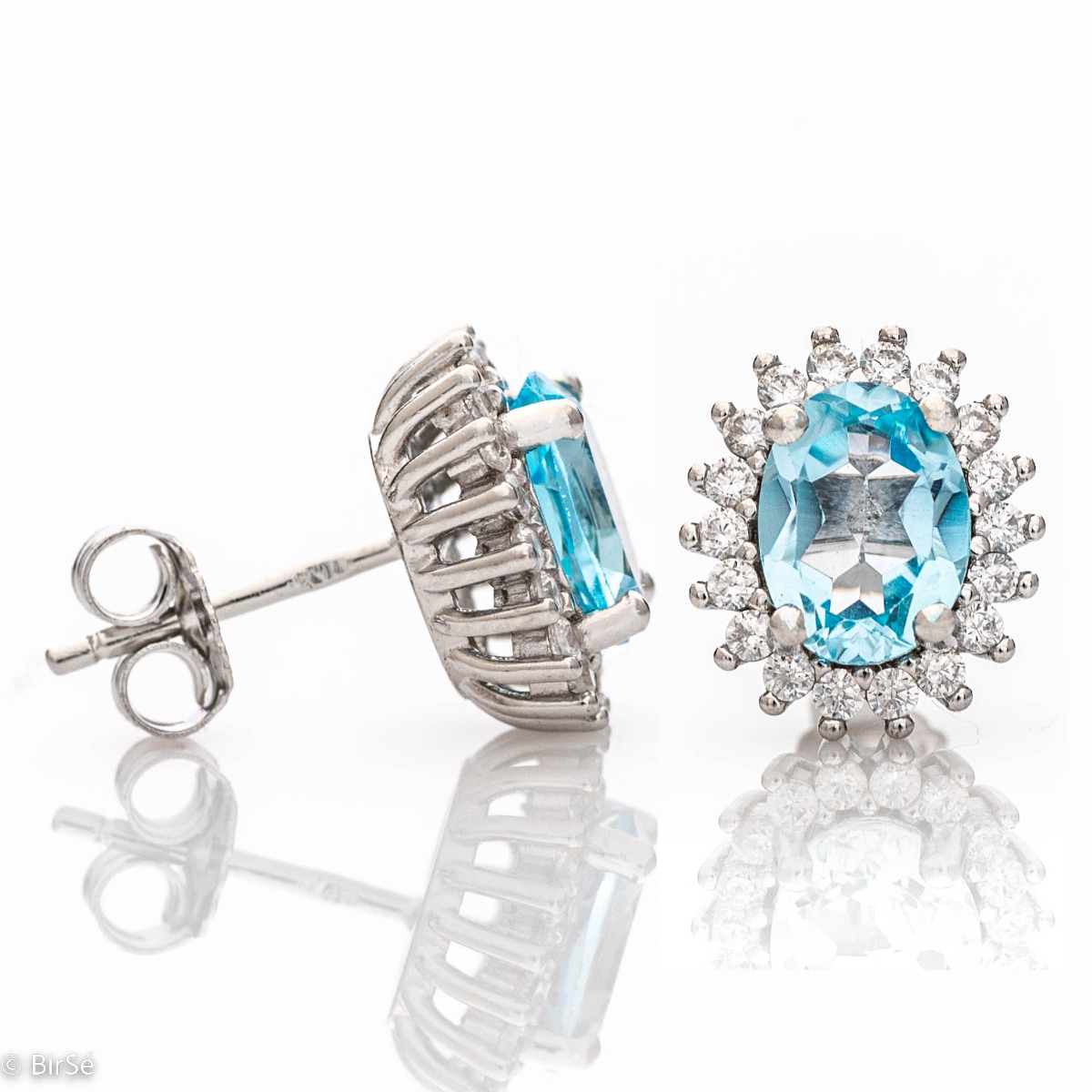 Delicate ladies' earrings with a Marquise shape and precision craftsmanship entirely of rhodium-plated silver, combined with a radiant natural Blue Topaz and sparkling zircons. In a charming pendant and ring set.