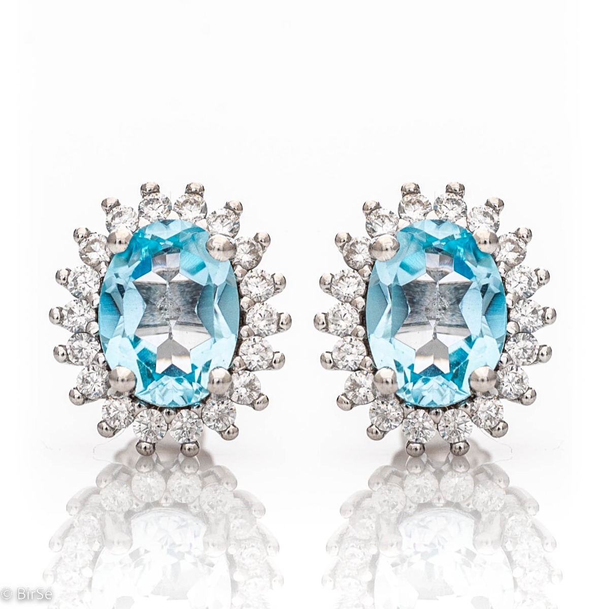 Delicate ladies' earrings with a Marquise shape and precision craftsmanship entirely of rhodium-plated silver, combined with a radiant natural Blue Topaz and sparkling zircons. In a charming pendant and ring set.