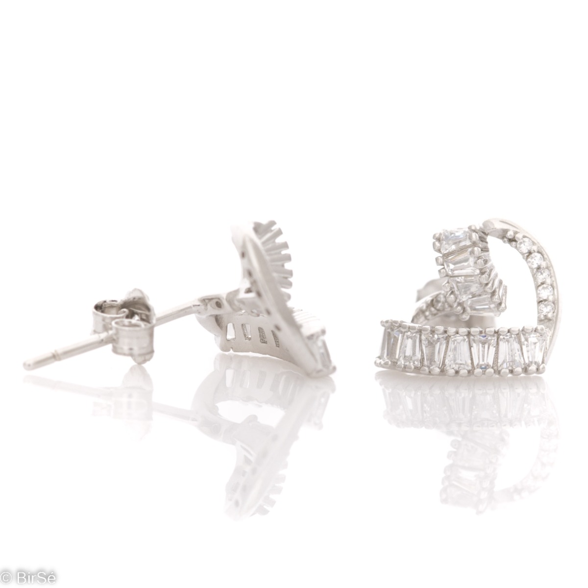 Captivating women's earrings with pin fastening and exquisite craftsmanship combining delicate rhodium silver with radiant glittering zircons of different shapes.