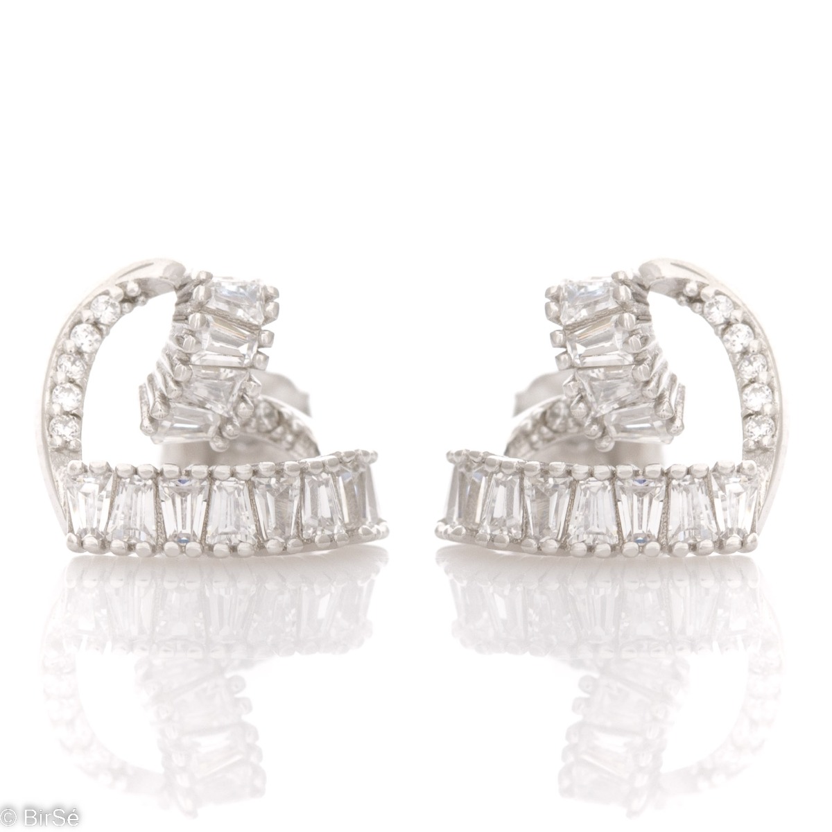 Captivating women's earrings with pin fastening and exquisite craftsmanship combining delicate rhodium silver with radiant glittering zircons of different shapes.