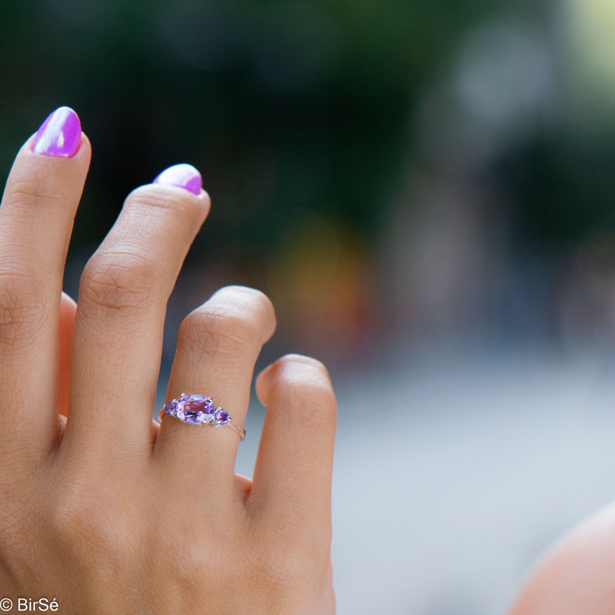 A stylish new offering for your jewelry collection. A ladies' ring made entirely of fine rhodium silver that gently envelops a magnetic amethyst.