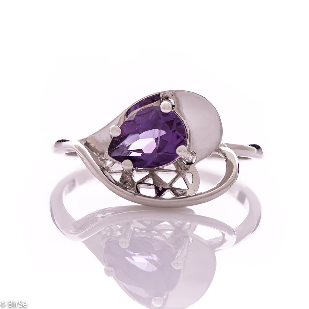 A spectacular women's ring with delicate workmanship entirely of rhodium-plated silver, resembling a heart intertwined with a radiant natural amethyst stone. It can be combined with a pendant and earrings of the same model.