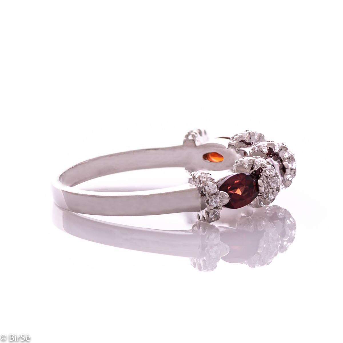 Delicate women's ring intertwining radiant natural garnet with sparkling zircons and exquisite workmanship entirely of rhodium-plated silver.